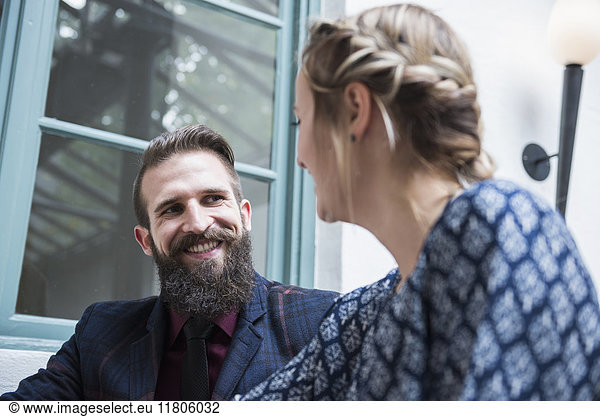 Young couple smiling while looking at each other