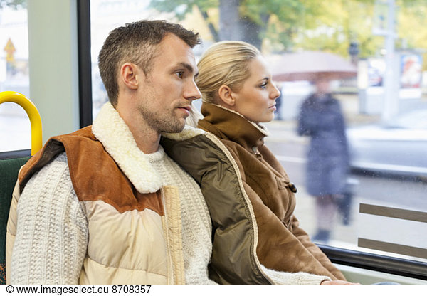 Young couple travelling in bus