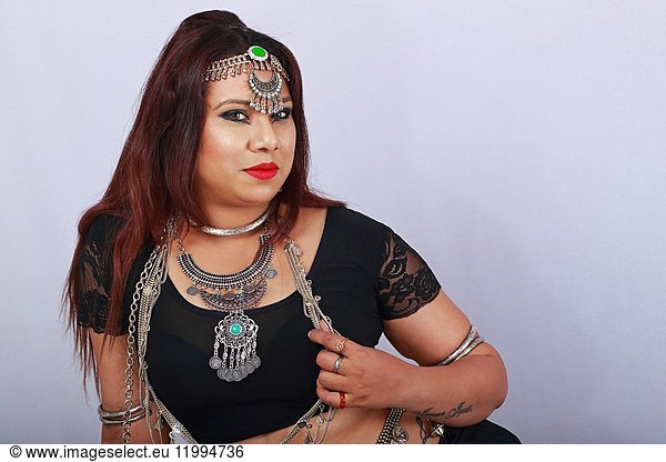 Young dancer in black dress and jewelry - Close-up.