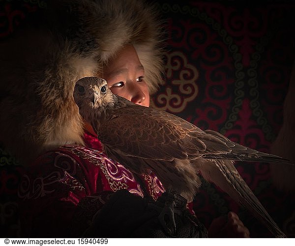 Young falcon hunter  boy with trained eagle  Bayan-Ölgii province  Mongolia  Asia