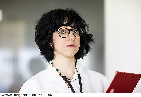 young female doctor with white coat