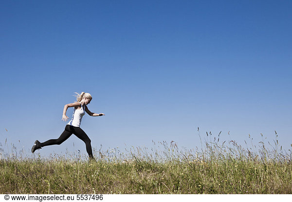 Young fit woman running to be in shape