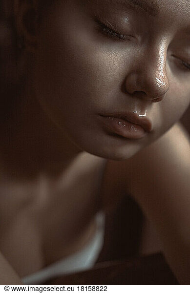 Young girl face close up. Sensual portrait with closed eyes