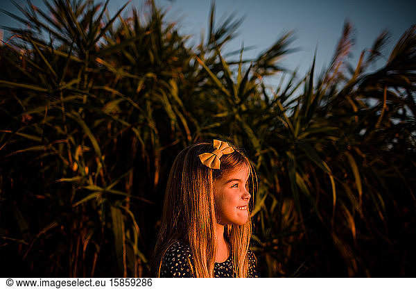 Young Girl Looking Off During Sunset