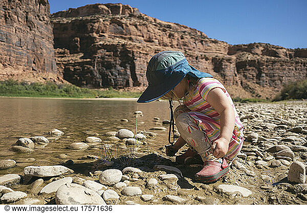 Young girl playing along the Colorado River  Utah