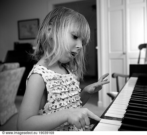 Young girl plays piano