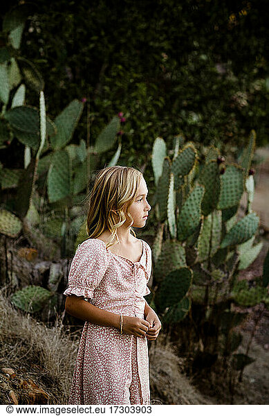 Young Girl Standing in Desert Garden in San Diego