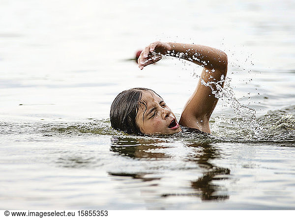 Young Girl Swimming in a Lake