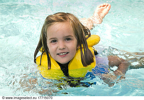 Young Girl Swimming With A Lifejacket On; Ontario Canada