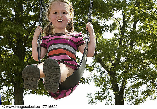 Young Girl Swinging High In The Air; Ontario Canada