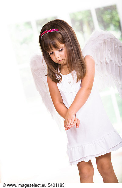 Young girl with angel wings