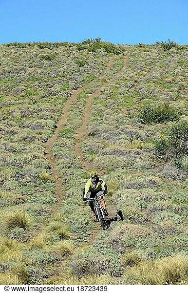 Young guy mountain biking in the hills of Patagonia  Chile