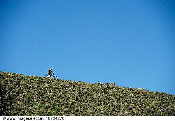 Young guy mountain biking in the hills of Patagonia  Chile