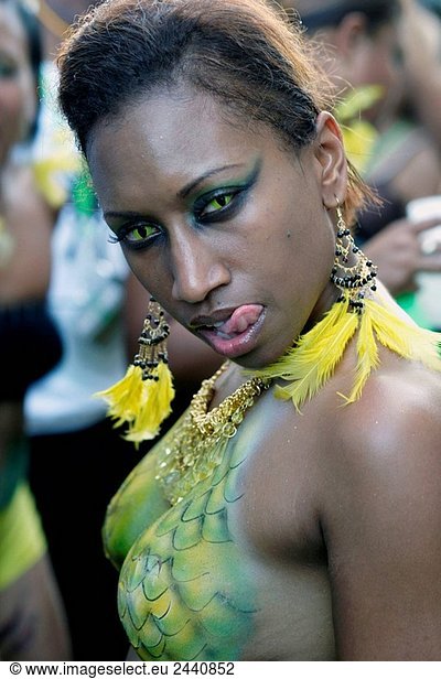 Young half nacked afro-american lady with cat like costume and cat like eyes with contact lenses at Trinidad Carnival  Queens Park Savannah  Port of Spain  Island of Trinidad  Republic of Trinidad and Tobago