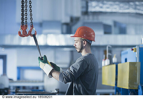 Young male engineer working in an industrial plant  Freiburg im Breisgau  Baden-Württemberg  Germany