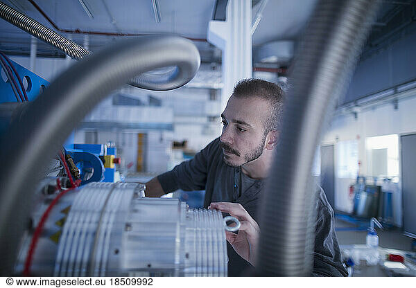 Young male engineer working in an industrial plant  Freiburg im Breisgau  Baden-Württemberg  Germany
