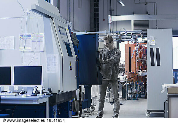 Young male engineer working in an industrial plant  Freiburg Im Breisgau  Baden-Württemberg  Germany