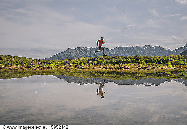 Young male trail running through at the Alps  Chamonix  France.