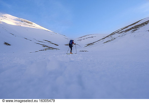 Young man cross-country skiing on Sibillini mountain against clear sky  Umbrian  Italy
