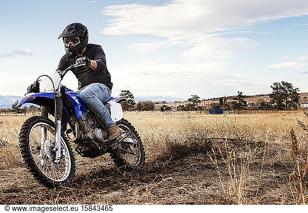 Young Man Dirt Biking in the Foothills in Colorado