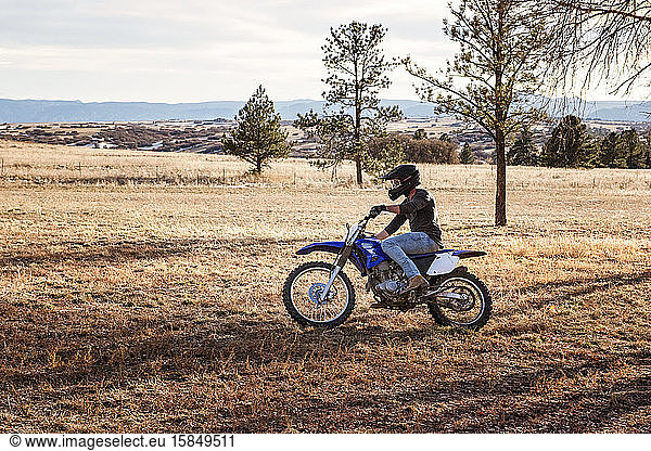 Young Man Dirt Biking in the Foothills in Colorado