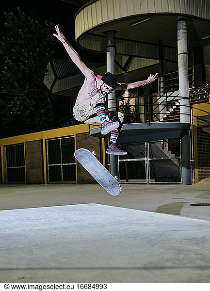 young man jumping on his skateboard