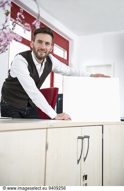 Young man office holding poster sign advert