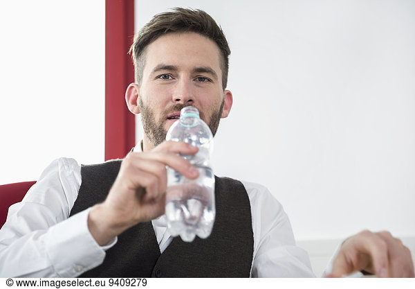 Young man office thirsty drinking water