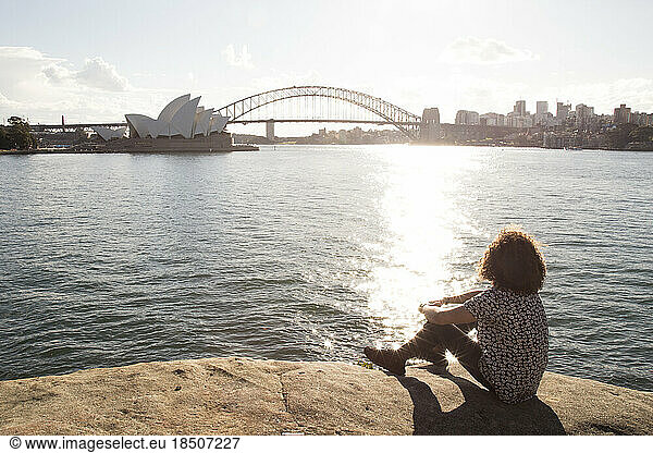 Young man relaxing by the ocean  at the Sydney Harbour  Australia
