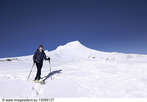 Young man snowshoeing