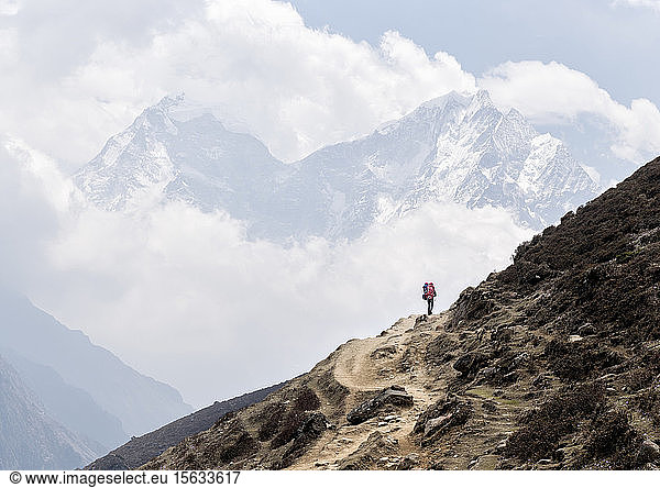 Young man trekking in the Himalayas  Solo Khumbu  Nepal