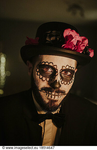 Young man wearing Day of the Dead costume