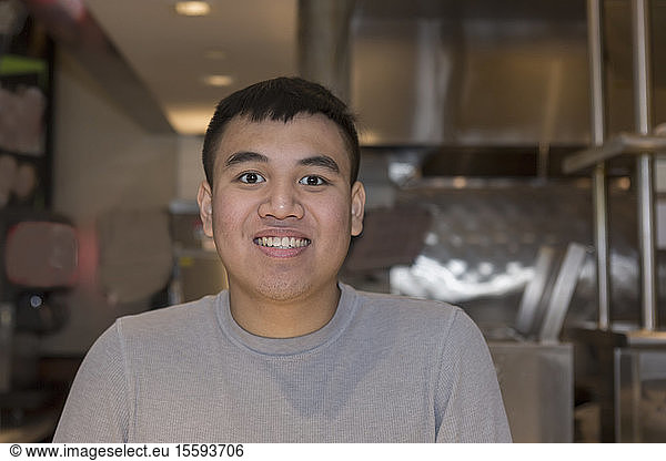 Young man with Autism working in a restaurant