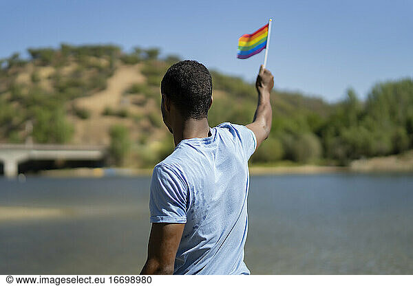 young man with his gay pride flag