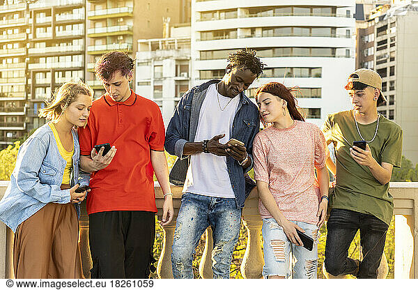 Young people using mobile phones.