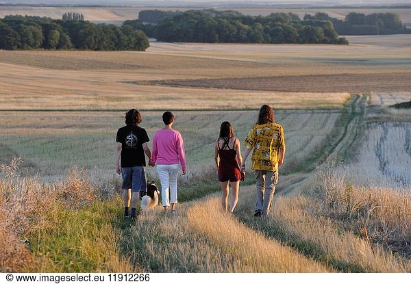 Young people walking around Mittainville  Yvelines department  Ile-de-France region  France  Europe.