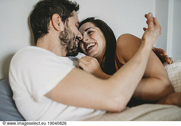 Young romantic couple in bed