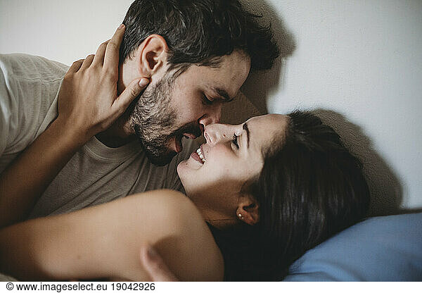Young romantic couple in bed