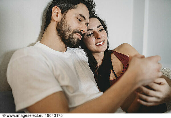 Young romantic couple in bed