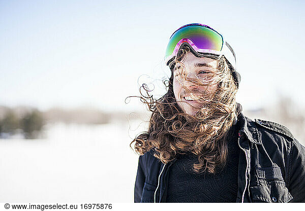 Young snowboarder during beautiful winter day outdoors