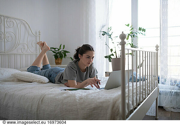 Young student preparing for exam at home