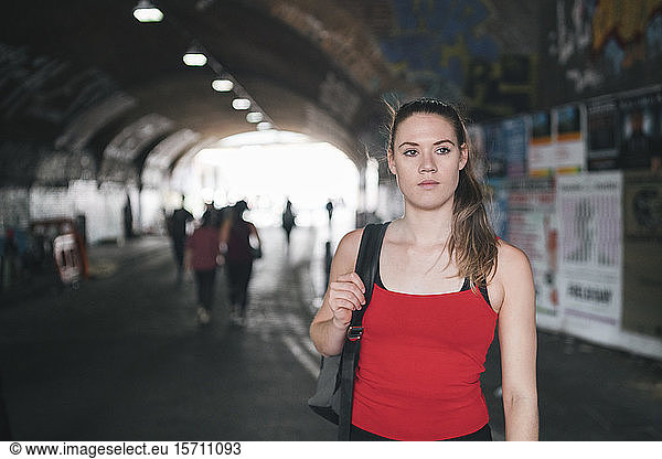 Young woman at an underpass in the city