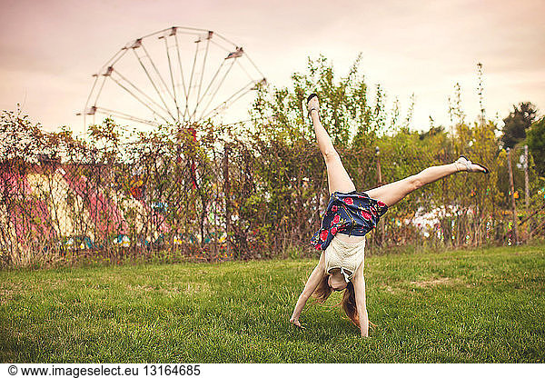 Young woman cartwheeling at Westford apple blossom carnival  Massachusetts USA