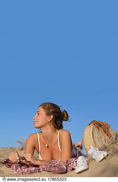young woman enjoys her vacation on the beach.