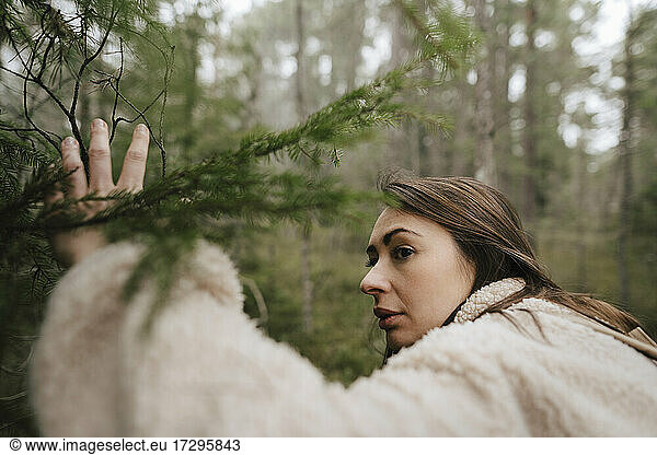 Young woman exploring in forest