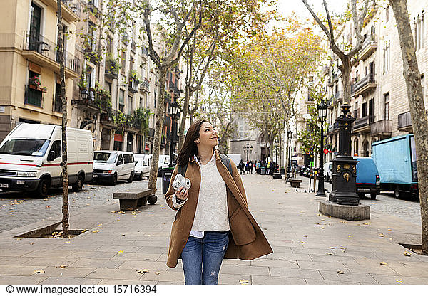 Young woman exploring the city  Barcelona  Spain