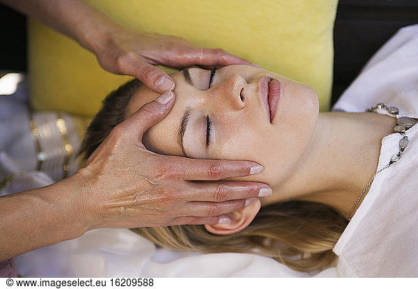 Young woman getting head massage
