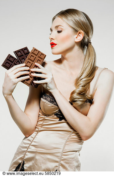 Young woman holding chocolate