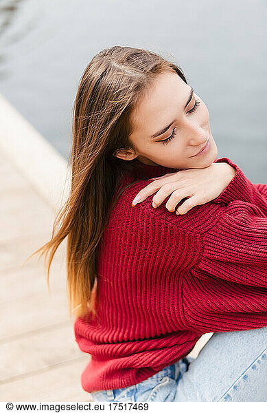 Young woman in red jumper close up