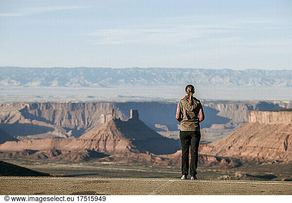 Young woman looks out over Castle Valley  Utah from La Sals.